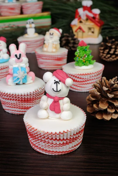 Sugar Christmas bear figurine on muffin — Stock Photo, Image