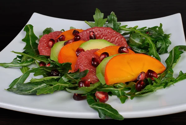 Salad with avocado, grapefruit, persimmon — Stock Photo, Image