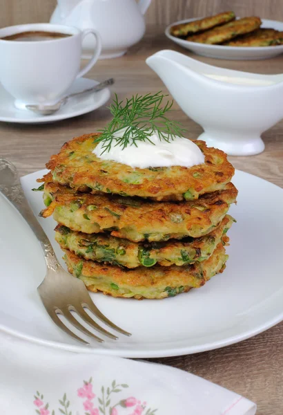 Fritters of zucchini and peas — Stock Photo, Image