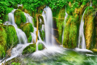 beautiful waterfalls on slopes clipart