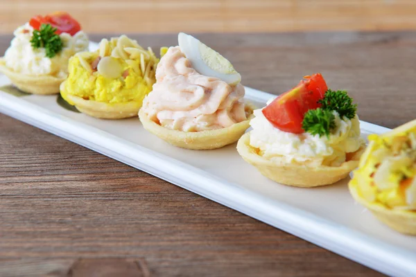 Tartlets with cream — Stock Photo, Image