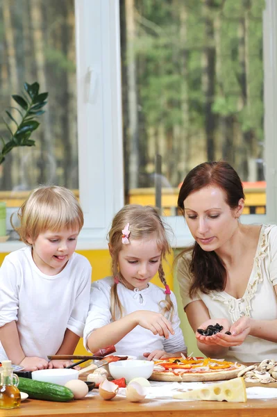 Mother with children cooking — Stock Photo, Image