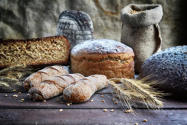 Fresh bread with buns and wheat — Stock Photo, Image