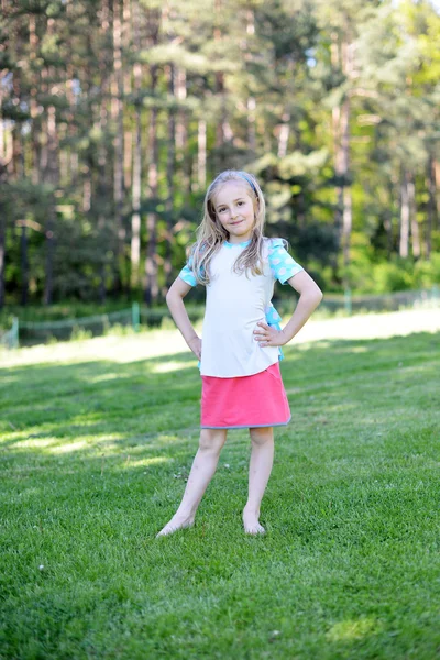 Girl on green lawn — Stock Photo, Image