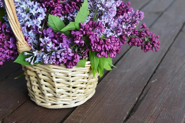 basket with  branch of lilac