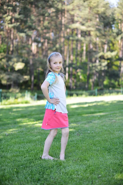 Girl on green lawn — Stock Photo, Image