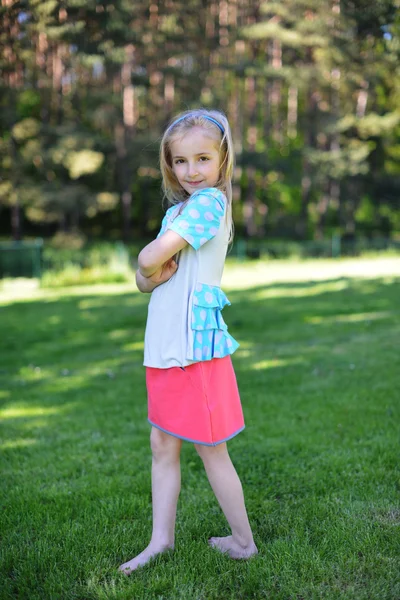 Girl on green lawn — Stock Photo, Image