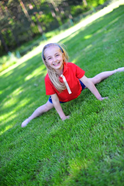 Girl on green lawn — Stock Photo, Image