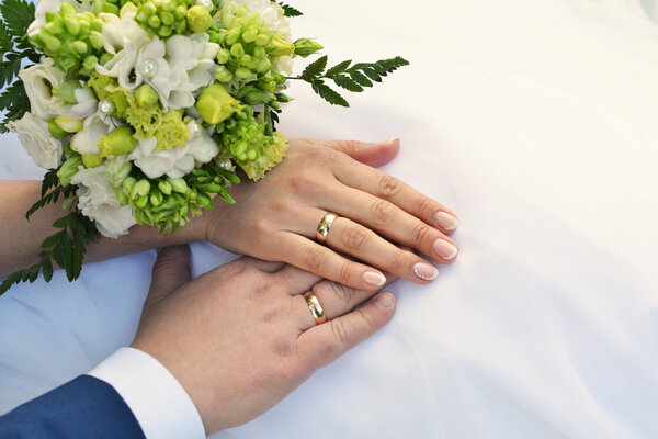 Hands with wedding rings