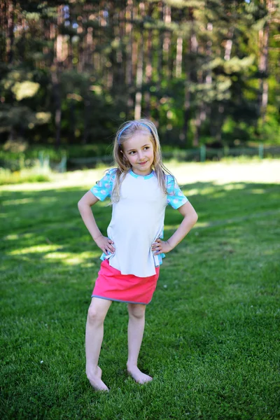 Girl on green lawn — Stock Photo, Image