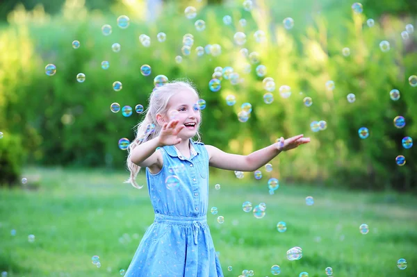 Girl on green lawn. — Stock Photo, Image