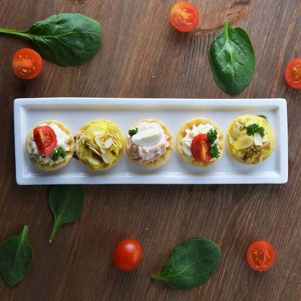 Tartlets with cream on dish — Stock Photo, Image