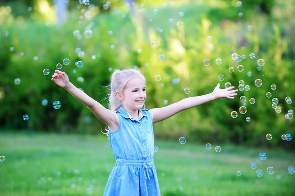 Girl on green lawn — Stock Photo, Image