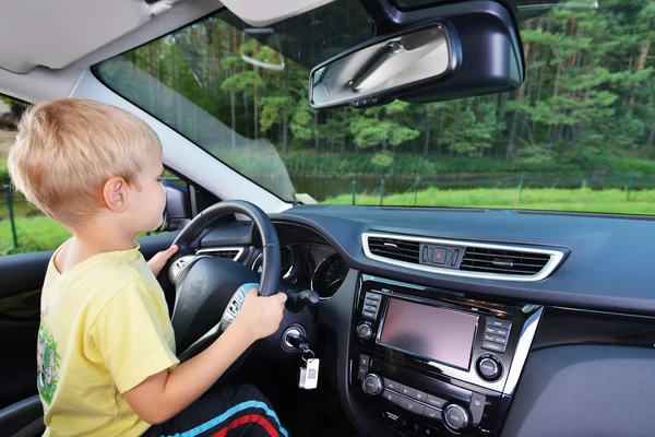 Little boy in car — Stock Photo, Image