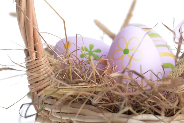 Basket wicker with easter eggs — Stock Photo, Image