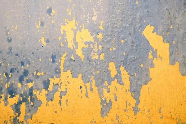 Wall in bad condition with old yellow and blue paint inside house — Stock Photo, Image