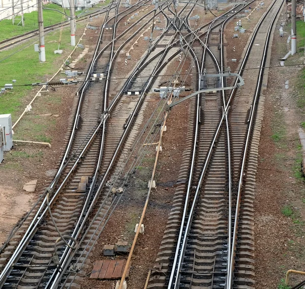 Rails on concrete sleepers, arrows and track equipment — Stock Photo, Image