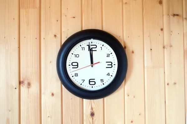 Big round wall clock on wooden background — Stock Photo, Image