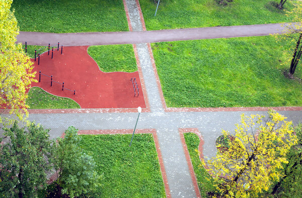 New Children's Playground outdoor with pedestrian ways in city district in summer day