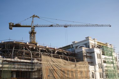 Crane on building reconstruction clipart