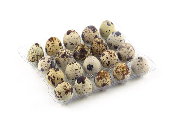 Wiele jaja przepiórcze w plastikowe pakiet na białym tle zbliżenie — Zdjęcie stockowe