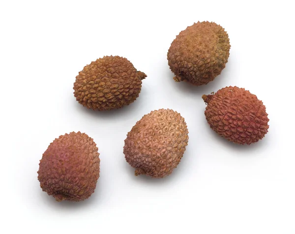 Five litchi fruits isolated on white closeup — Stock Photo, Image