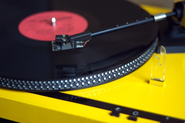 Turntable with vinyl record close seup — стоковое фото