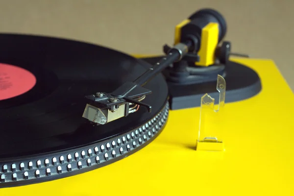 Turntable with vinyl record close seup — стоковое фото