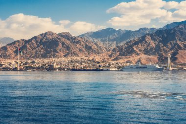 View on the Aqaba waterfront and Aqaba sea port, Jordan from the Red sea clipart