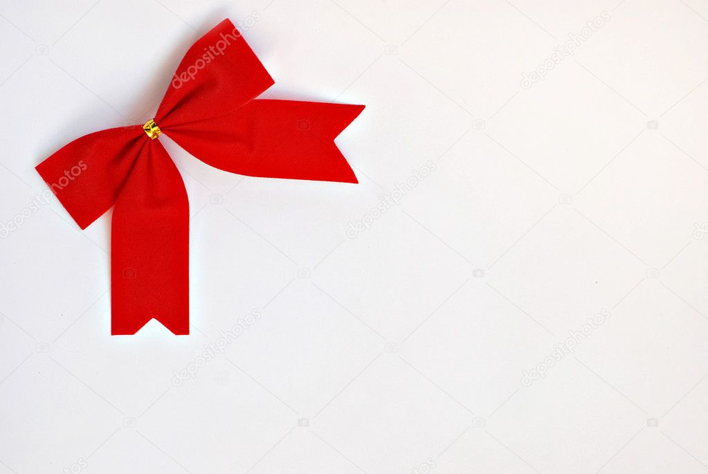 Red holiday bow on white background