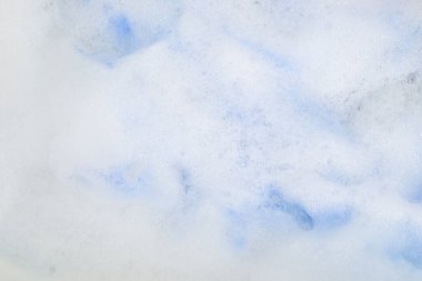Mavi boyalı sabunlu köpük. Arkaplan olarak kullanılabilir.