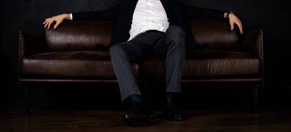 Unrecognizable Stylish Macho Man Sits Relaxed Sofa Dark — Stock Photo, Image