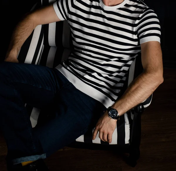 Unrecognizable Man Striped Shirt Sits Striped Armchair — Stock Photo, Image