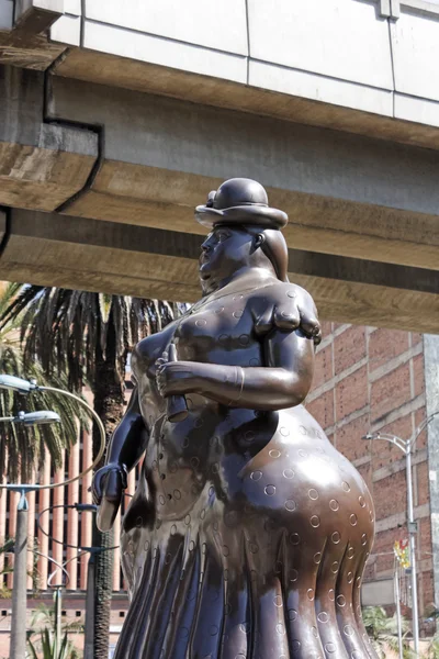 The statue 'woman dressed'. Botero square, Medellin. — Stockfoto