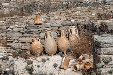 Ancient pottery wine amphora found in the ruins on the island of clipart