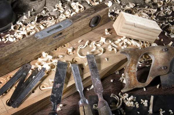 Workplace carpenter. Wood and a few tools Royalty Free Stock Photos