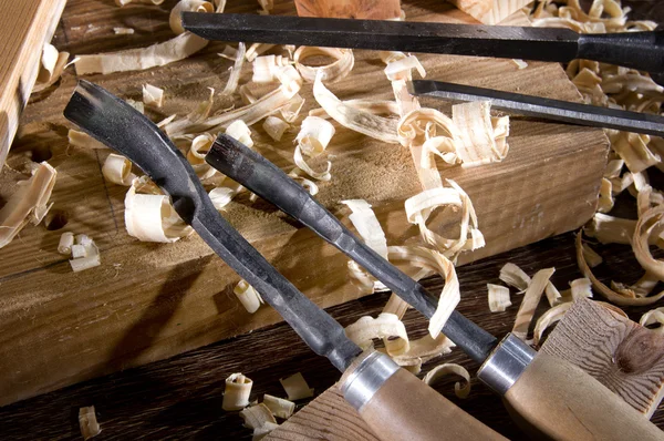 Workplace carpenter. Wood and a few tools Stock Image