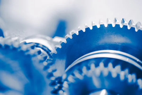 Промышленный фон с синими зубчатыми колесами — стоковое фото