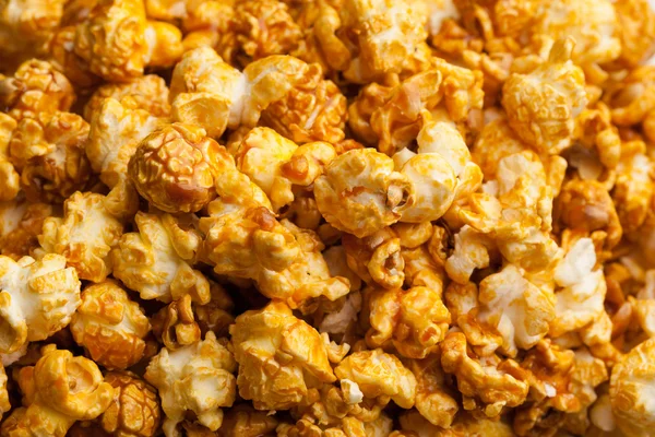 Karamel pop corn achtergrond, close-up weergave — Stockfoto