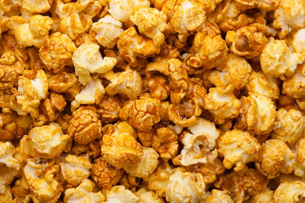 Karamel pop corn achtergrond, close-up weergave — Stockfoto