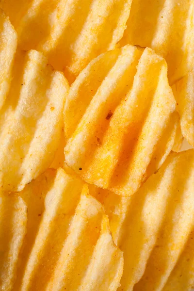 Rippled potato chips background — Stock Photo, Image