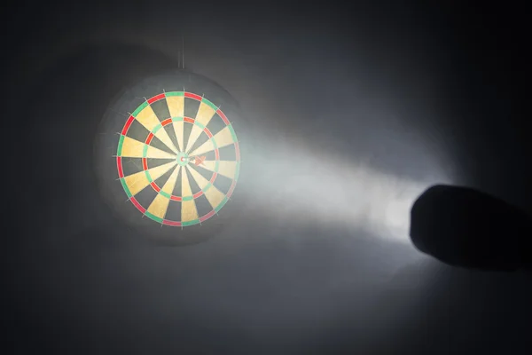 Darts board illuminated with a spotlight — Stock Photo, Image