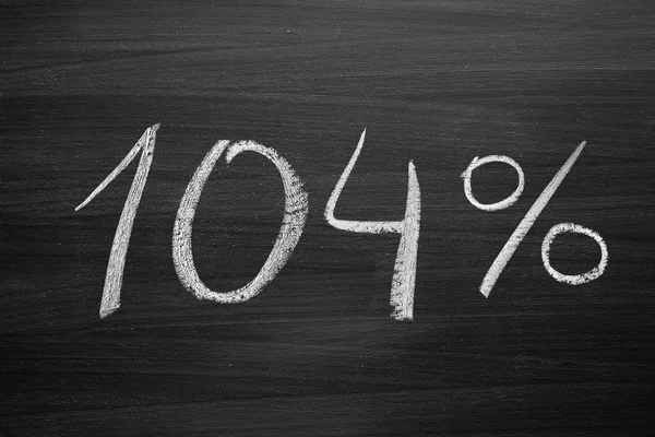 104 percent header written with a chalk on the blackboard — Stock Photo, Image