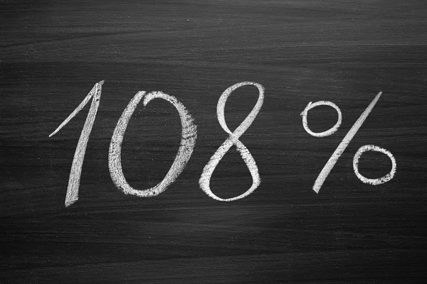 108 percent header written with a chalk on the blackboard — Stock Photo, Image