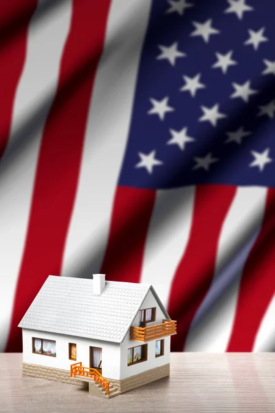 House against USA flag background — Stock Photo, Image