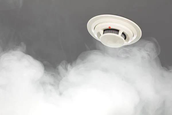 smoke detector on ceiling, fire alarm in action