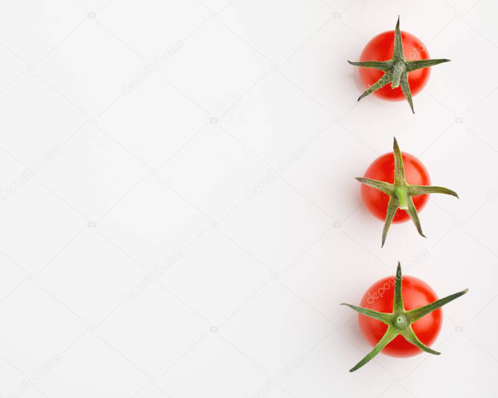 cherry tomatoes on white background with copy-space