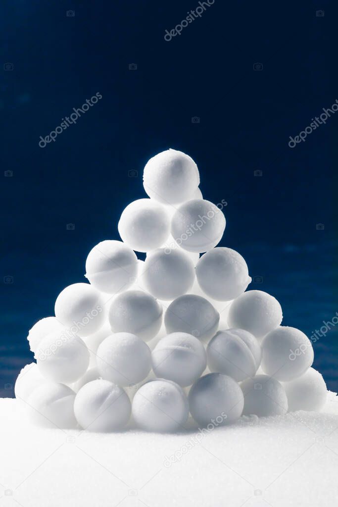 snowballs heap on dark blue background