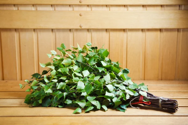 Bunch of green birch twigs in sauna — Stock Photo, Image