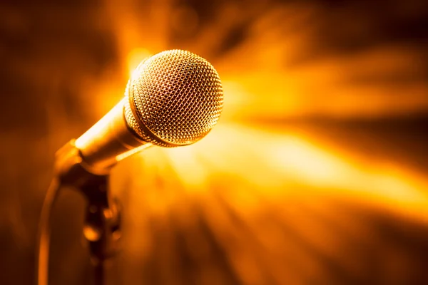 Golden microphone on stage — Stock Photo, Image